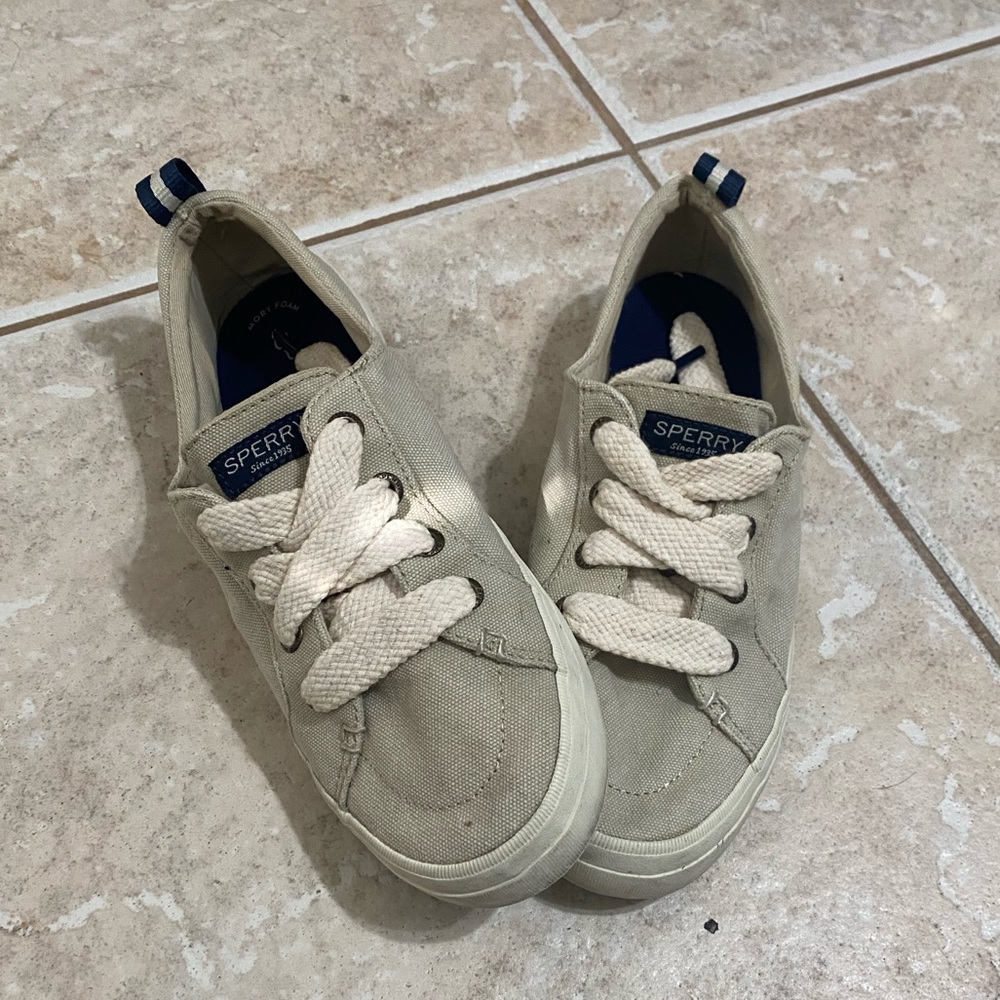 Women’s cream Sperry shoes, size 8.5.